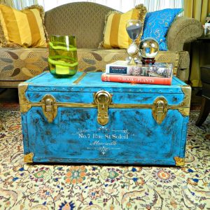 gold and blue painted storage trunk