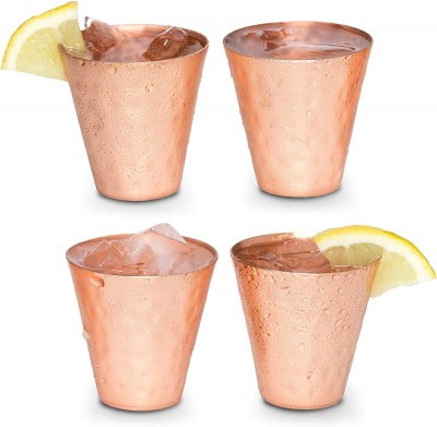 four copper shot glasses with lemon slices