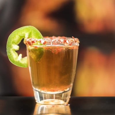 a shot of vorka with green pepper slice